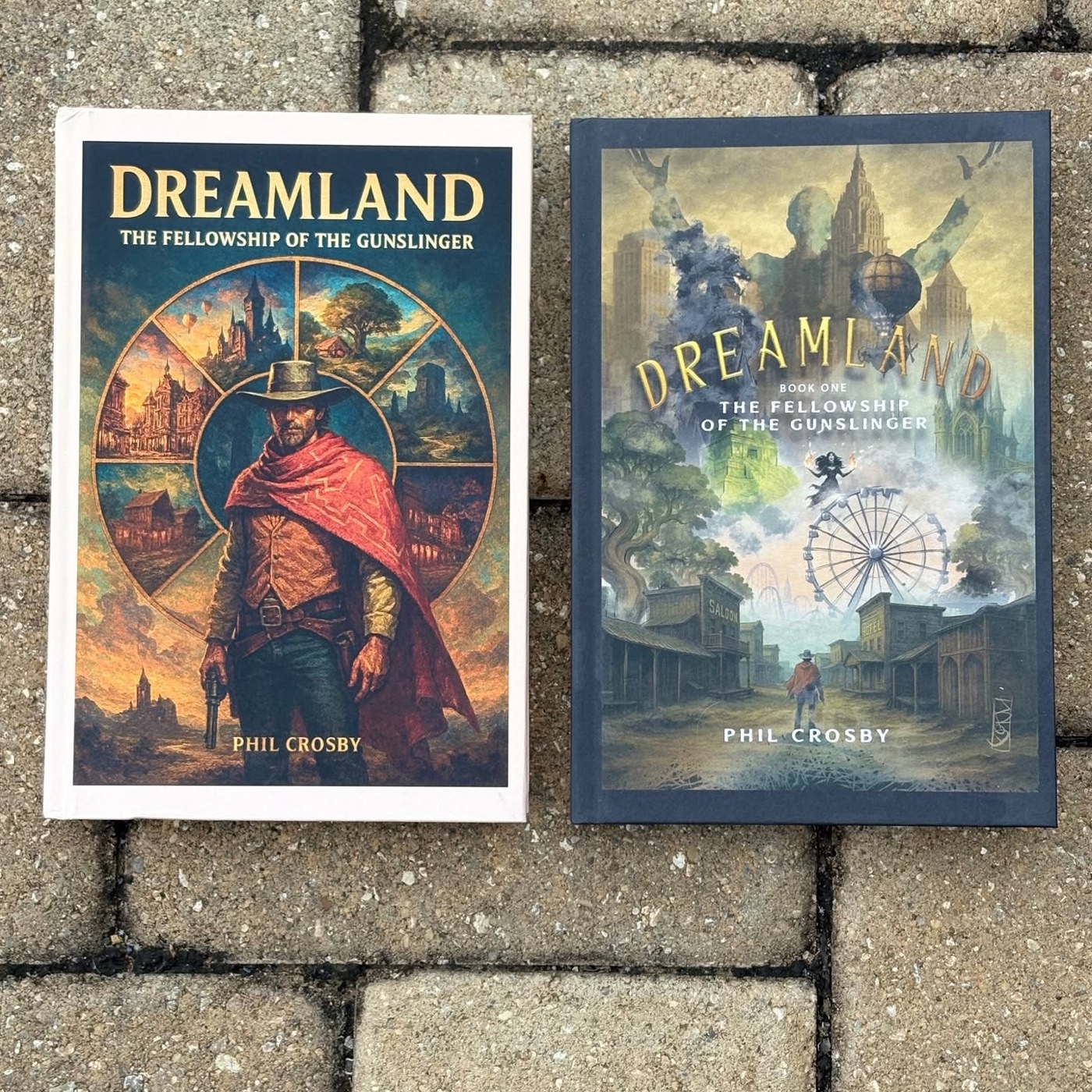 The hardcover and paperback editions of DreamLand side by side on a stone walkway, each with different cover art
