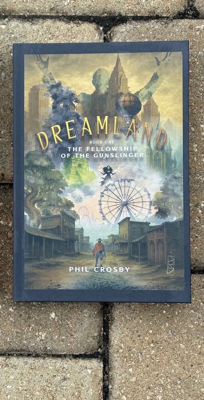 The paperback edition of DreamLand on a stone walkway